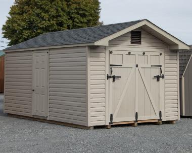 10x16 Peak Style Shed with Rampage Door And Pebble Clay Vinyl Siding